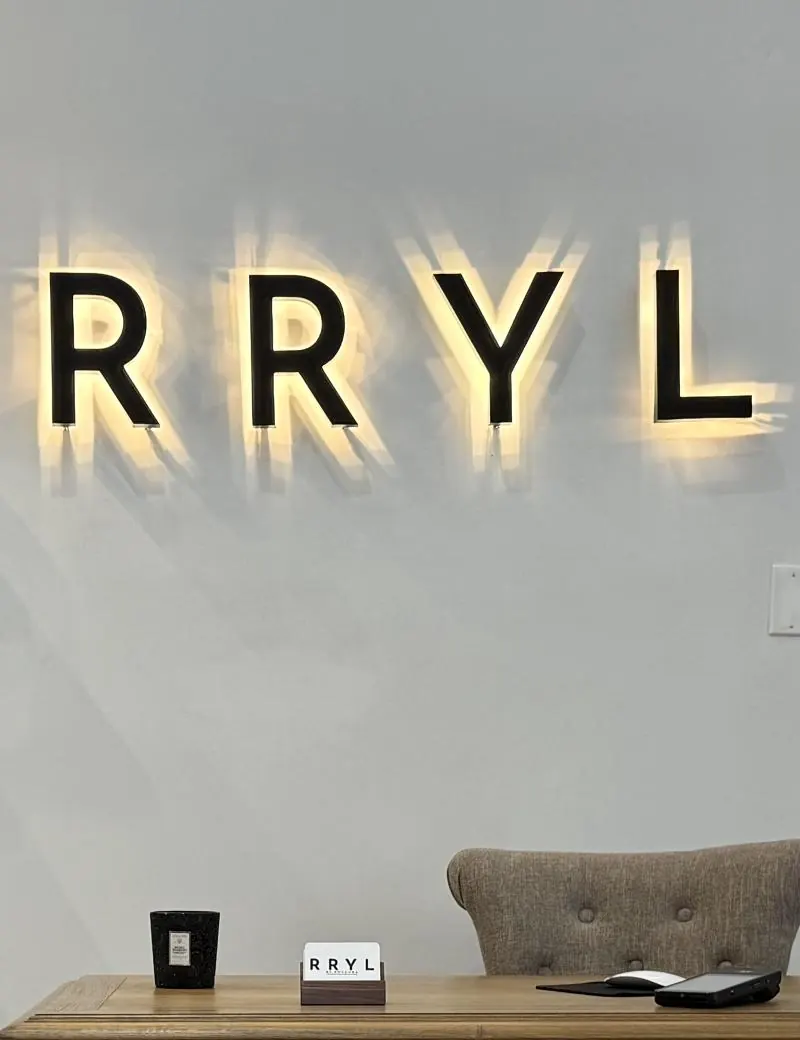 The illuminated RRYL sign in the studio